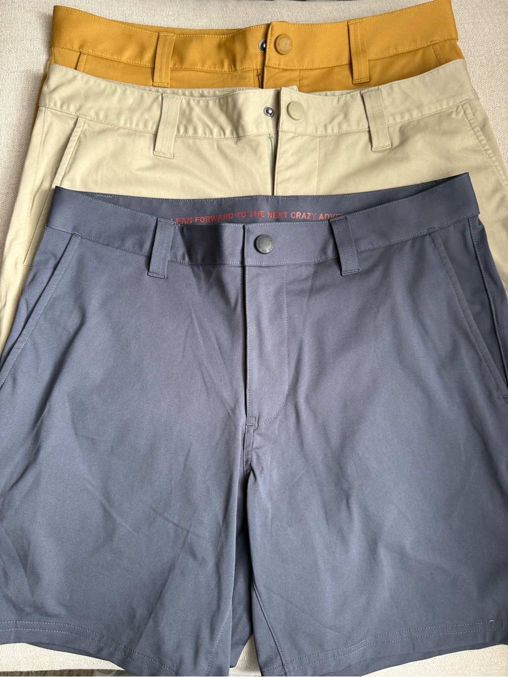 RHONE Men's Shorts in Tan and Navy Logo